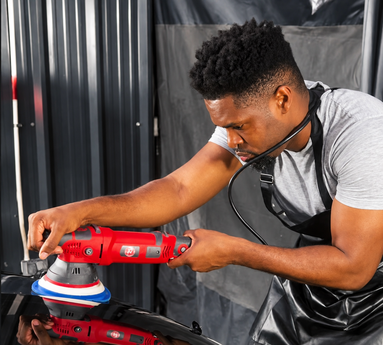 André Giles working on a vehicle at Giles Car Care